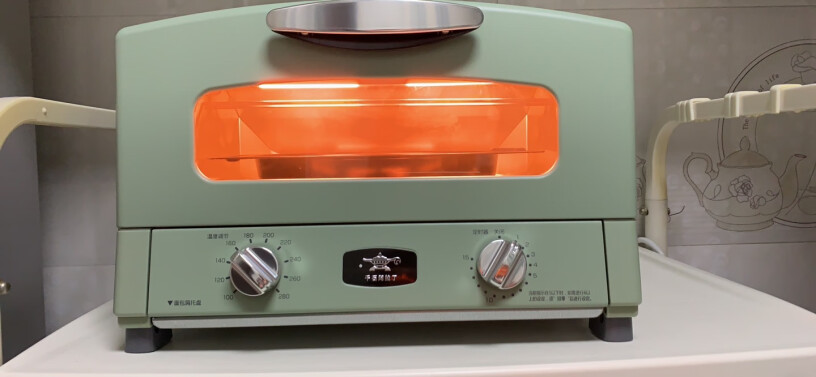 千石阿拉丁日式网红家用多功能迷你电烤箱请问这个烤箱的温度和时间是可以在工作中随时调整的吗？