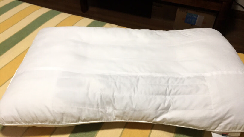 富安娜家纺圣之花枕头芯颈椎枕草本枕芯是软的还是硬点的？