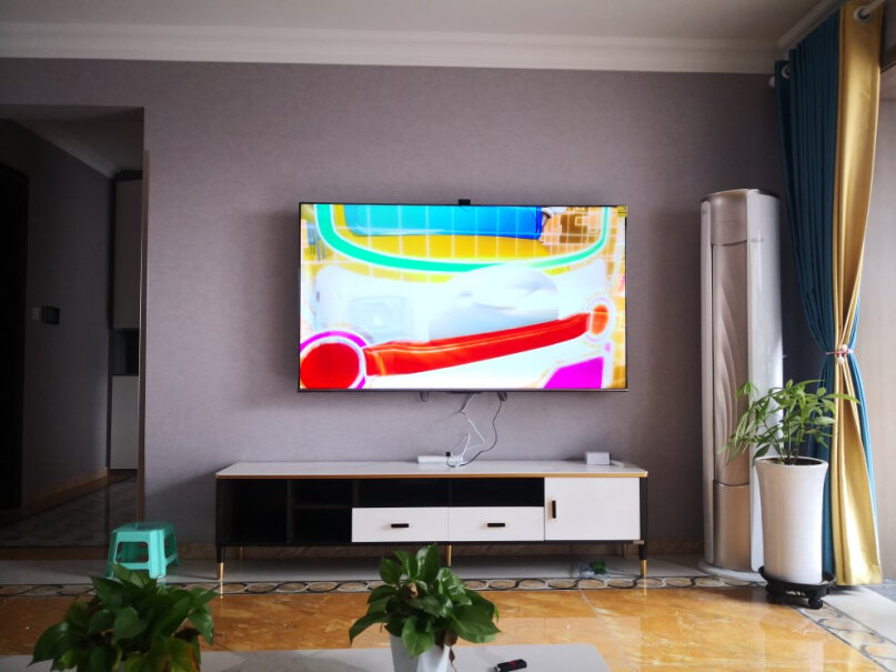 海信电视75E5G75英寸4K超清声控智慧屏我家墙与墙距离4.2米，建议买几寸？