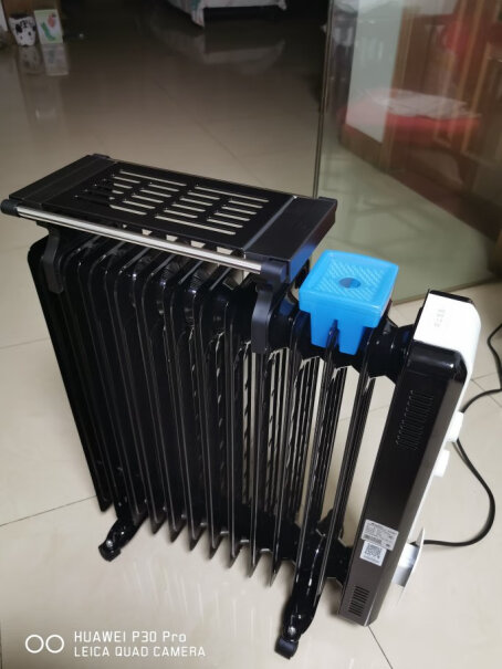 格力取暖器这个跟空调比哪个暖和，哪个费电？