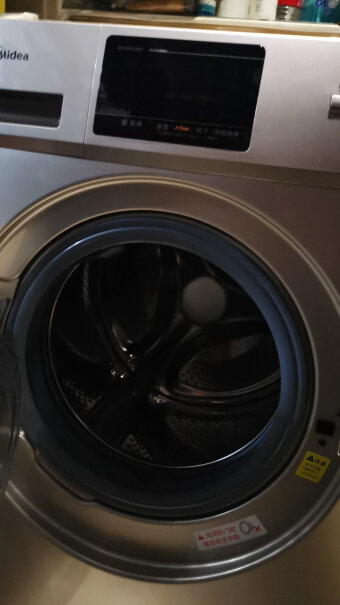 美的滚筒洗衣机全自动10公斤大容量请问我的洗衣机屏幕出现E10是什么意思？