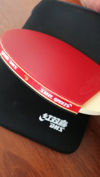 红双喜DHSE-E206直拍双面反胶乒乓拍健身型为什么我买的根本没有弹性，球从10厘米高处自由落下，都弹不起来？