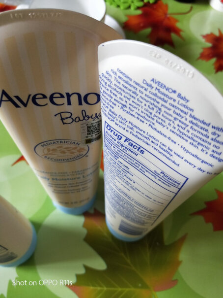 Aveeno艾惟诺婴儿保湿润肤身体乳这怎么查是不是正品啊，连个外包装都没有，确实是有味道？