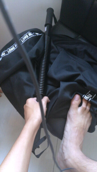 臂力器男臂力棒握力棒健身器材家用可调节健身棒黑色经典版这个包可以背着吗？