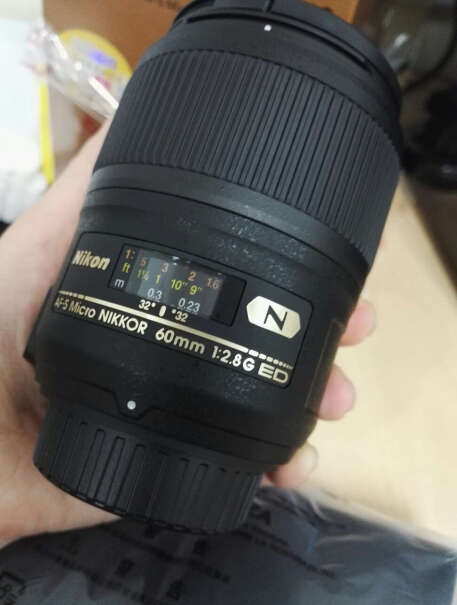 尼康微距镜头105mm f/2.8GDX是什么意思？用在半幅机身要设置什么嘛？