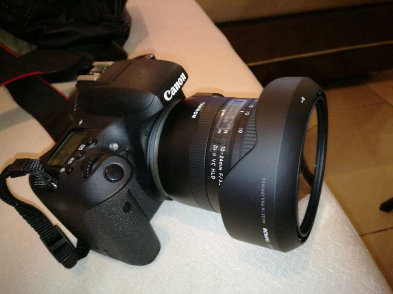 腾龙B023 超广角变焦镜头和佳能的10-22/f3.5-4.5USM相比，除去原厂因素，哪个好？
