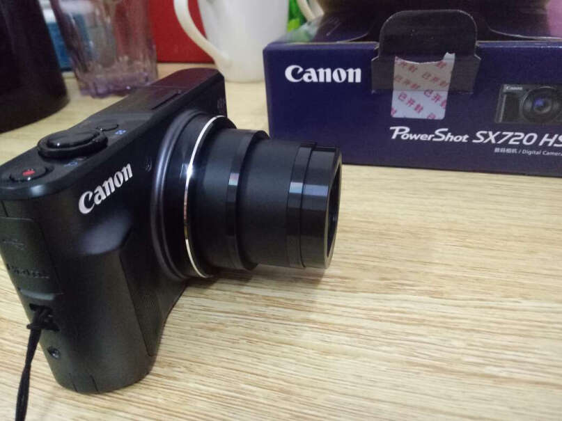 佳能PowerShot SX720 HS数码相机镜头有灰尘怎么办？