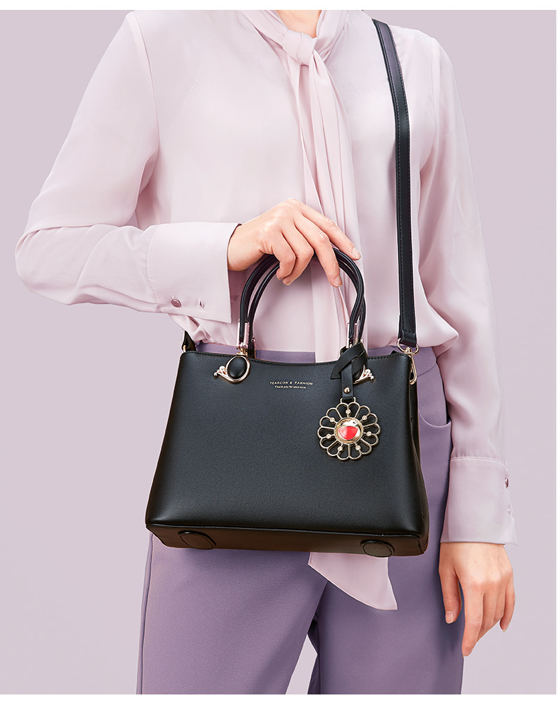 意尔康(yearcon)包包女时尚单肩包百搭斜挎包太阳花简约手提包13w