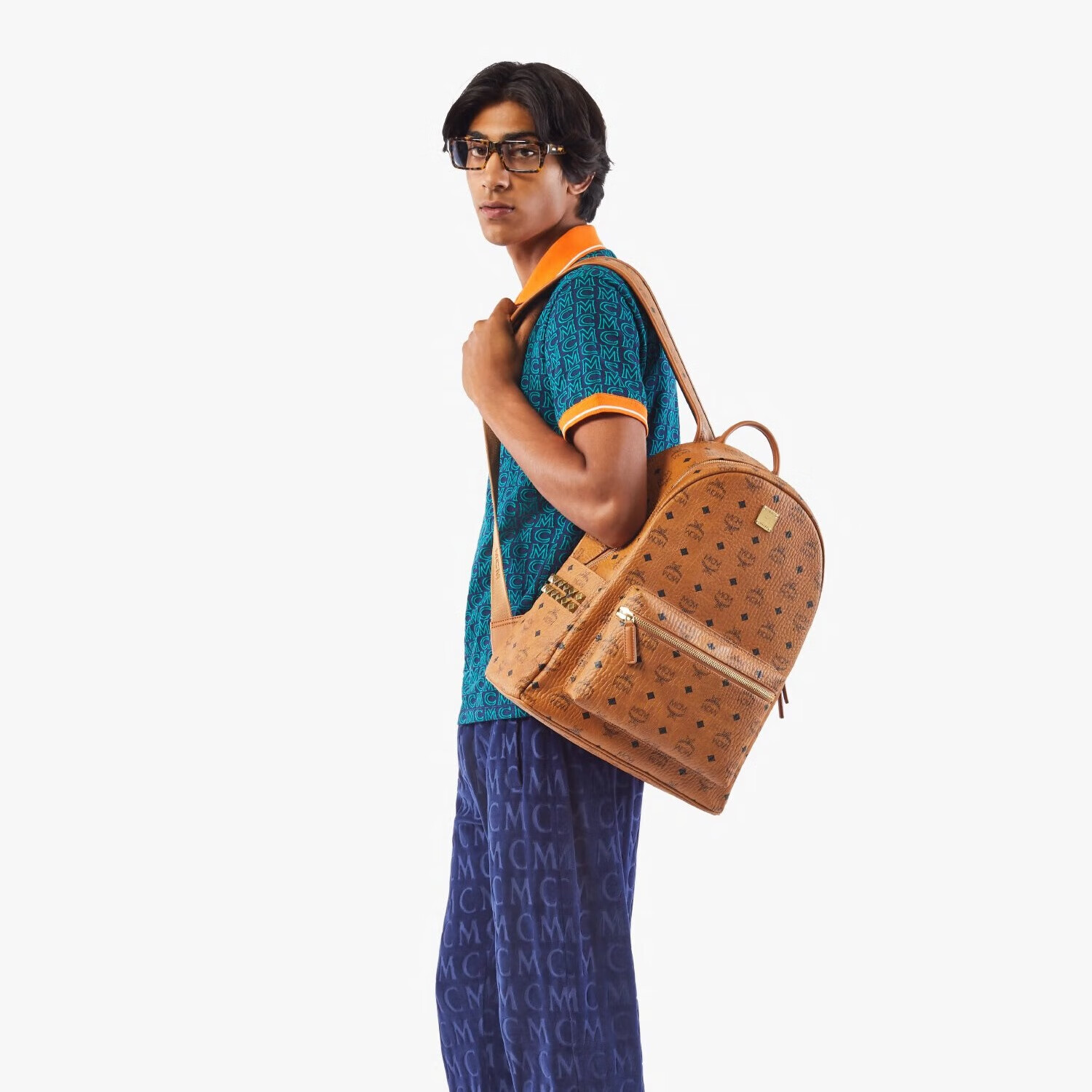 MCM STARK Medium-Sized Side-Trimmed Rivet Casual Backpack, Large Capacity, Cognac Color